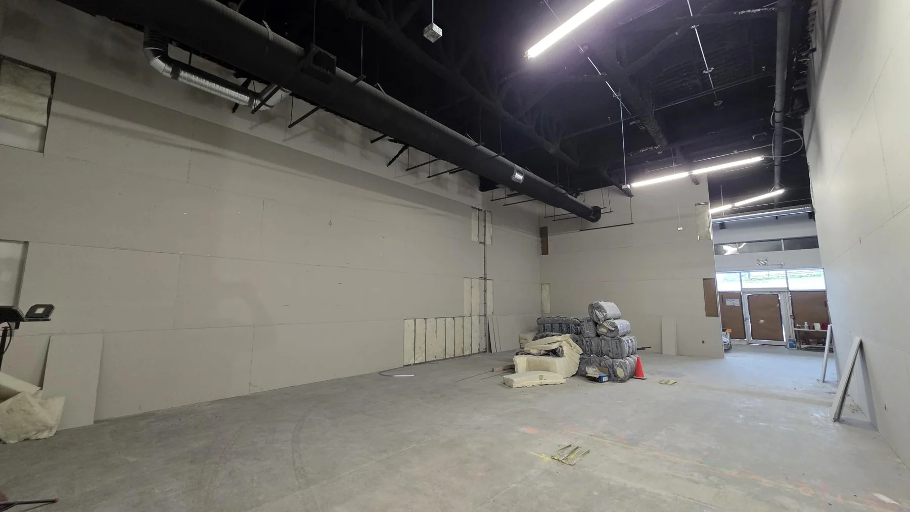 Boarded retail partitions at Club Champion in Surrey